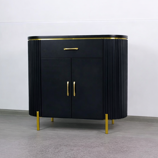 Black cabinet with gold accents on a gray floor and white wall