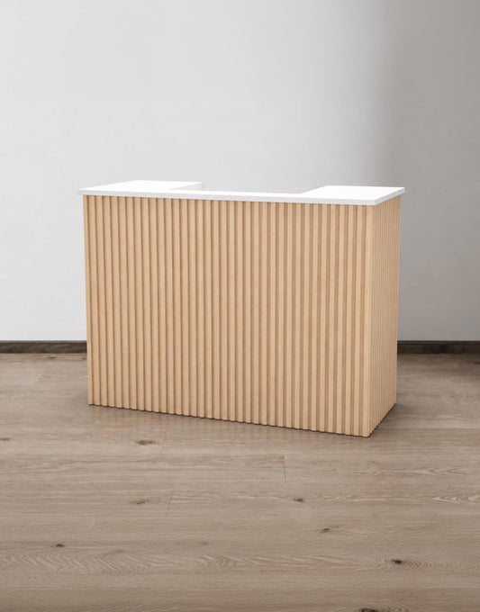 Aria Natural Oak 59-inch tambour reception desk with a white painted countertop, angled front view